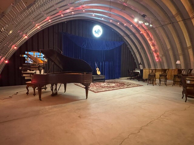 Grand piano and stage inside The Vortex