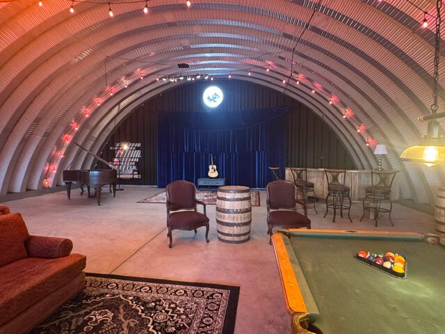 The Vortex lounge with billiards and stage lighting