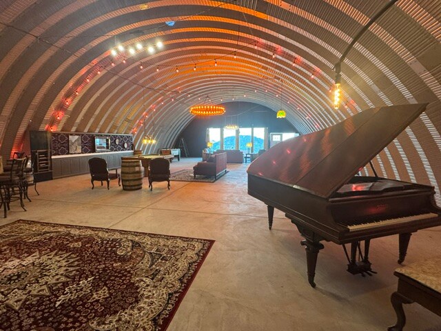 Grand piano beneath the arched steel ceiling of The Vortex